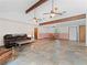 Spacious living room features vaulted ceilings with wood beams and tile flooring at 601 136Th St E Ct, Bradenton, FL 34212