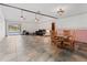 Spacious living room with vaulted ceilings, tile flooring, and a view of the pool through sliding glass doors at 601 136Th St E Ct, Bradenton, FL 34212