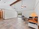 Bright living room with tile flooring, vaulted ceilings, ceiling fans, and a glimpse of the pool at 601 136Th St E Ct, Bradenton, FL 34212