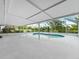 Screened-in pool and patio area offers a tranquil view of the lake, creating a peaceful retreat at 601 136Th St E Ct, Bradenton, FL 34212
