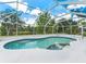 Inviting screened-in pool with a lake view at 601 136Th St E Ct, Bradenton, FL 34212