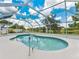Refreshing screened-in pool with scenic lake view at 601 136Th St E Ct, Bradenton, FL 34212