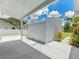 Exterior view of a well-maintained shed under a carport at 601 136Th St E Ct, Bradenton, FL 34212