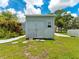 Outside of shed with gray wood, a window, and double doors at 601 136Th St E Ct, Bradenton, FL 34212