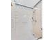 Walk-in shower with grab bars, handheld showerhead and molded shelving at 601 136Th St E Ct, Bradenton, FL 34212