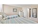 Bright bedroom with twin beds, adjacent bathroom, and neutral color scheme at 6265 Midnight Pass Rd # 205, Sarasota, FL 34242