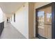 Hallway view of unit 205, showing the entrance and nearby buildings at 6265 Midnight Pass Rd # 205, Sarasota, FL 34242