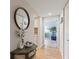 Hallway with mirror and views to the kitchen and living room at 6265 Midnight Pass Rd # 205, Sarasota, FL 34242