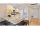 Eat in kitchen offers granite countertops, an island with seating, and stainless steel appliances at 6265 Midnight Pass Rd # 205, Sarasota, FL 34242