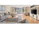 Cozy living room features plush seating and entertainment center at 6265 Midnight Pass Rd # 205, Sarasota, FL 34242