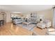 Open-concept living room and dining area with lots of seating at 6265 Midnight Pass Rd # 205, Sarasota, FL 34242