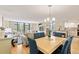Open concept living and dining area features a view of the lanai, kitchen, and living room at 6265 Midnight Pass Rd # 205, Sarasota, FL 34242
