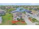 Beautiful aerial view of this home with lush backyard and water view at 6266 Buckingham St, Sarasota, FL 34238