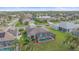 Aerial view of home with screened in pool and lush greenery surrounding the property at 6266 Buckingham St, Sarasota, FL 34238