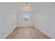 Bedroom with light flooring, closet, ceiling fan and window at 6266 Buckingham St, Sarasota, FL 34238