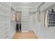 Walk-in closet featuring custom shelving and plenty of room for storage at 6266 Buckingham St, Sarasota, FL 34238