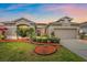 Charming single-Gathering home featuring manicured landscaping and a well-maintained lawn at 6266 Buckingham St, Sarasota, FL 34238