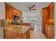Kitchen featuring stainless appliances, wood cabinets, and granite countertops at 6266 Buckingham St, Sarasota, FL 34238