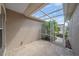 Enclosed patio featuring tile flooring and a glass-enclosed garden area with a beautiful view at 6266 Buckingham St, Sarasota, FL 34238