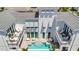 An aerial view showcasing a private pool, patio, and balcony in the home's backyard at 6317 Turtle Grass Dr, Bradenton, FL 34210