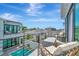 An expansive balcony showcases the surrounding community and a stunning pool at 6317 Turtle Grass Dr, Bradenton, FL 34210