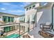 Balcony view of the pool with outdoor seating overlooking the private courtyard at 6317 Turtle Grass Dr, Bradenton, FL 34210