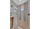 Modern bathroom with glass shower, mosaic tile accents, and sleek fixtures create a spa-like retreat at 6317 Turtle Grass Dr, Bradenton, FL 34210