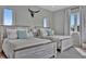 Bright bedroom with two beds, coastal decor, and ample natural light creating a welcoming space at 6317 Turtle Grass Dr, Bradenton, FL 34210
