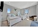 Bright bedroom with two beds, coastal decor, and ample natural light creating a welcoming space at 6317 Turtle Grass Dr, Bradenton, FL 34210
