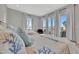 Bright bedroom with two beds, coastal decor, and ample natural light creating a welcoming space at 6317 Turtle Grass Dr, Bradenton, FL 34210
