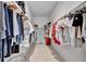 Walk-in closet is well-organized and spacious, with ample hanging and storage space for clothes and accessories at 6317 Turtle Grass Dr, Bradenton, FL 34210