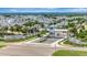 Gated waterfront community with tropical landscaping, white modern homes, and views of the bay at 6317 Turtle Grass Dr, Bradenton, FL 34210
