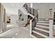 Grand entryway featuring a modern staircase and stylish decor at 6317 Turtle Grass Dr, Bradenton, FL 34210