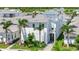 Two-story home with a manicured front yard, lush landscaping and a private balcony at 6317 Turtle Grass Dr, Bradenton, FL 34210