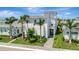 Beautiful two-story home with a manicured lawn and lush tropical landscaping at 6317 Turtle Grass Dr, Bradenton, FL 34210