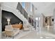 A bright, open-concept entry area with contemporary finishes and tile flooring at 6317 Turtle Grass Dr, Bradenton, FL 34210
