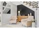 Sitting area with modern staircase, contemporary decor, and stylish accents create a welcoming foyer at 6317 Turtle Grass Dr, Bradenton, FL 34210
