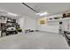 Spacious garage with ample storage, work area, and golf cart parking at 6317 Turtle Grass Dr, Bradenton, FL 34210
