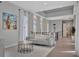 Bright hallway with tray ceilings, white trim, and many windows allowing for ample natural light at 6317 Turtle Grass Dr, Bradenton, FL 34210
