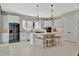 Modern kitchen featuring stainless steel appliances, white cabinetry, and spacious island, ideal for culinary enthusiasts at 6317 Turtle Grass Dr, Bradenton, FL 34210