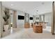 Bright living room featuring modern seating arrangement, sleek lighting and access to the outdoor living area at 6317 Turtle Grass Dr, Bradenton, FL 34210