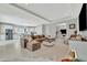 Spacious open-concept living area flowing to the kitchen and office, with cozy sectional sofa and bright tile floors at 6317 Turtle Grass Dr, Bradenton, FL 34210
