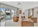 Open living room boasts modern seating, sleek lighting, and outdoor access to a private pool at 6317 Turtle Grass Dr, Bradenton, FL 34210