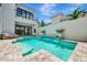Backyard pool and patio area with lounge seating and lush tropical landscaping at 6317 Turtle Grass Dr, Bradenton, FL 34210