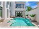 Backyard pool area with waterfall feature, sun shelf, and ample seating at 6317 Turtle Grass Dr, Bradenton, FL 34210