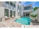 Stunning outdoor living space with a modern pool, patio, and fire pit at 6317 Turtle Grass Dr, Bradenton, FL 34210