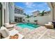 The backyard features a modern pool, beautiful patio, and well-manicured landscaping at 6317 Turtle Grass Dr, Bradenton, FL 34210
