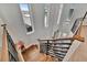 Modern staircase with wood steps and black metal railings, bathed in natural light at 6317 Turtle Grass Dr, Bradenton, FL 34210