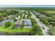 Aerial view of the home showing the proximity to a pond and the lovely neighborhood at 6516 Palm Leaf Ct, Sarasota, FL 34243