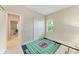 Neutral bedroom featuring a closet and a window for natural lighting at 6516 Palm Leaf Ct, Sarasota, FL 34243